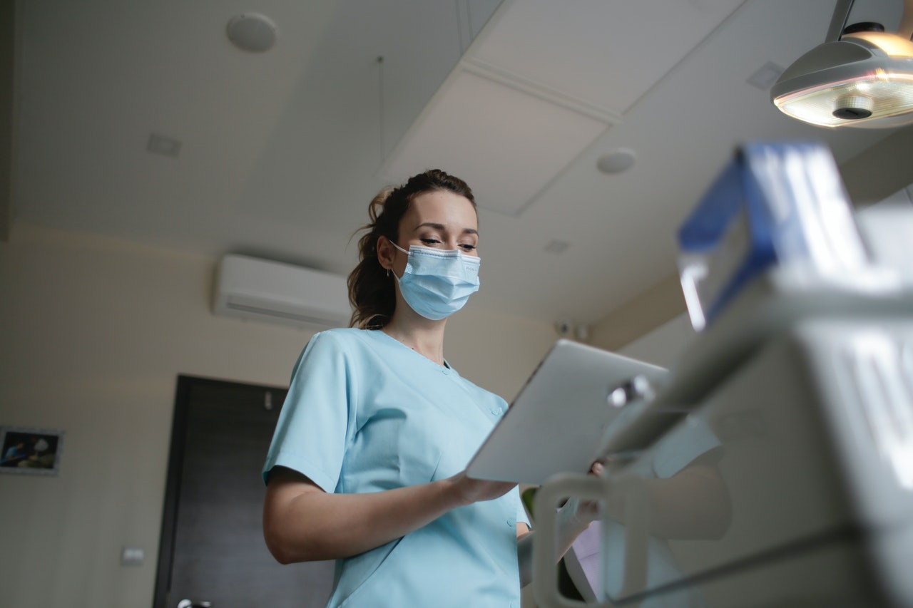 nurse with questionaire for medication treatment